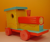 Brinquedo decorativo - Locomotiva: Brinquedo de madeira pintado com tintas acrílicas. Acabamento em verniz transparente mate. Preço: 8.00 